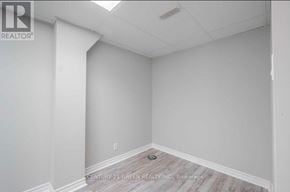 Oshawa (Mclaughlin) apartment for rent - A white room with a wooden floor and a skylight.