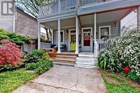 Toronto (South Riverdale) apartment for rent - A house with a green door and a porch.
