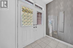 Newmarket (Glenway Estates) townhouse for rent - A white door with a glass window and a mirror on the wall.