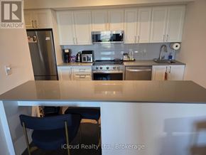 Mississauga (Lakeview) condo for rent - A kitchen with a refrigerator, oven, and microwave.