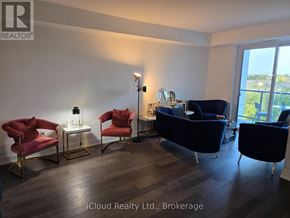 Mississauga (Lakeview) condo for rent - A living room with a blue couch and red chairs.