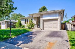 Burlington (Shoreacres) apartment for rent - A house with a driveway in front of it.