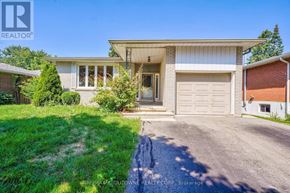 Burlington (Shoreacres) apartment for rent - A house with a driveway in front of it.