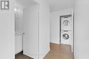 Toronto (Mimico) condo for rent - A laundry room with a washer and dryer.