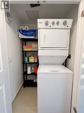 Brampton (Bram East) townhouse for rent - A small laundry room with a washer and dryer.