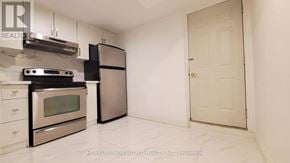 Mississauga (Creditview) apartment for rent - A kitchen with a stove top oven and a refrigerator.