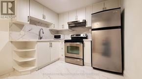 Mississauga (Creditview) apartment for rent - A modern kitchen with stainless steel appliances and white cabinets.