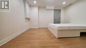 Mississauga (Creditview) apartment for rent - A bedroom with a bed, cupboard and a door.