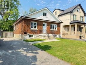 Mississauga (Lakeview) apartment for rent - A house with a brick exterior and a white roof is shown.