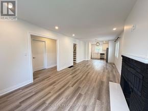 Mississauga (Lakeview) apartment for rent - A spacious room with wooden flooring and white walls.