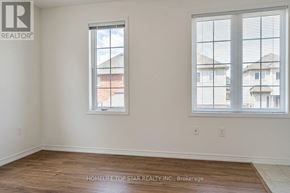 Markham (Cornell) apartment for rent - A room with two windows, one facing a residential area and the other a street.