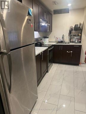Brampton (Credit Valley) apartment for rent - A kitchen with a stainless steel refrigerator and white tile flooring.