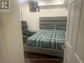 Brampton (Credit Valley) apartment for rent - A bedroom with a bed, pillows, and a nightstand.