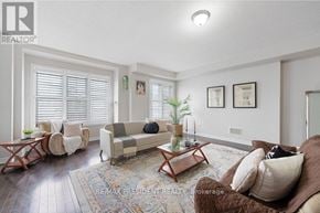 Brampton (Northwest Brampton) townhouse for rent - A living room with a couch, chairs, and a rug.