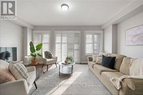 Brampton (Northwest Brampton) townhouse for rent - A living room with a couch, chair, and coffee table.