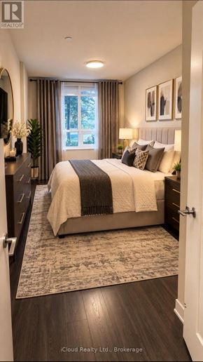 Barrie (Painswick South) condo for rent - A bedroom with a large bed and a window with curtains.
