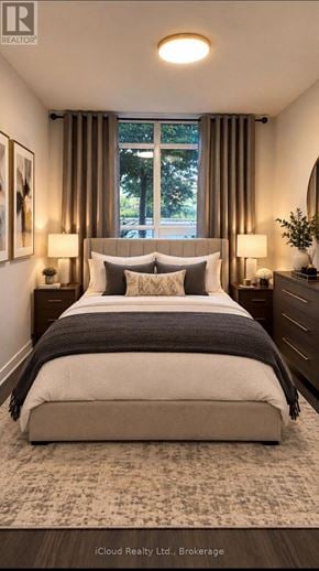 Barrie (Painswick South) condo for rent - A bedroom with a large bed and a window with curtains.