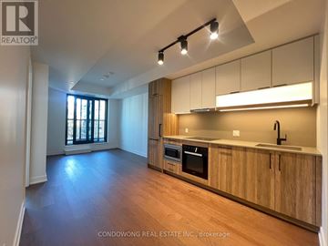 Toronto (Forest Hill South) condo for rent - A modern kitchen with wooden cabinets and stainless steel appliances.