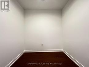 Toronto (Forest Hill South) condo for rent - A room with white walls and a wooden floor.