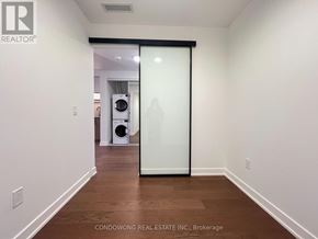 Toronto (Forest Hill South) condo for rent - A room with a sliding door leading to another room.