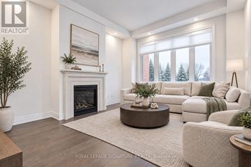 Aurora (Aurora Estates) apartment for rent - A living room with a fireplace and a painting on the wall.