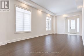 Aurora (Aurora Estates) apartment for rent - A spacious room with wooden floors and white walls.