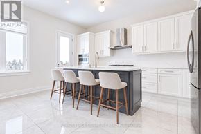 Aurora (Aurora Estates) apartment for rent - A kitchen with white cabinets and a black countertop.