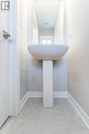 Hamilton (Ryckmans) townhouse for rent - A white pedestal sink in a narrow bathroom.