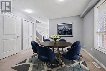 Guelph (Grange Road) apartment for rent - A dining room with a round table and chairs.