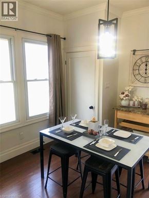 London apartment for rent - A dining room with a table set for two.