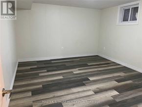 Toronto (Newtonbrook East) apartment for rent - A room with wooden flooring and a window.