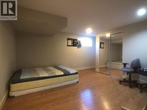 Vancouver apartment for rent - A bedroom with a bed, desk, and chair.
