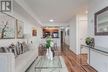 Toronto (Agincourt South-Malvern West) condo for rent - A well-lit living room with a glass coffee table and a white sofa.