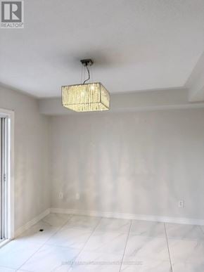 Mississauga (Churchill Meadows) townhouse for rent - A room with a chandelier hanging from the ceiling.