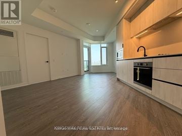 Mississauga (Central Erin Mills) condo for rent - A kitchen with a stove top oven and a counter top.