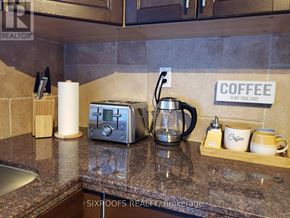 Toronto (Danforth Village-East York) apartment for rent - A coffee station with a toaster, coffee pot and cups.