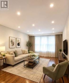 Toronto (Cliffcrest) apartment for rent - A living room with a couch, chair, and a coffee table.