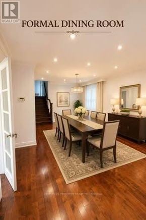 Toronto (Cliffcrest) apartment for rent - A formal dining room with a wooden table and chairs.