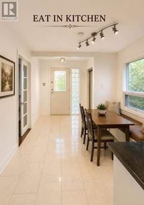 Toronto (Cliffcrest) apartment for rent - A kitchen with a table and chairs in the middle of the room.