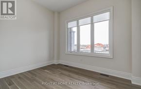 Georgina (Keswick South) apartment for rent - A room with a window showing a view of buildings outside.