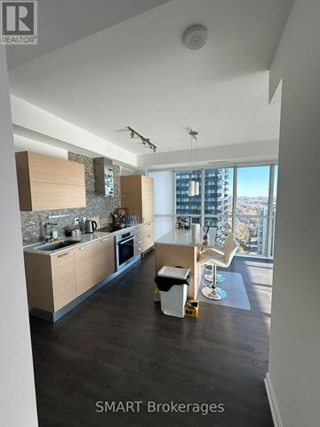 Toronto (Lansing-Westgate) condo for rent - A modern kitchen with a view of the city.