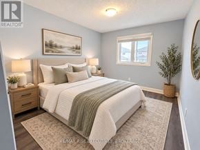 Kingston (City Northwest) apartment for rent - A bedroom with a large bed and a painting on the wall.