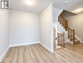 Ottawa townhouse for rent - A room with a staircase leading to the upper floor.