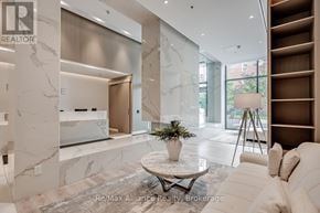 Burlington (Brant) condo for rent - A modern living room with a marble floor and a white sofa.