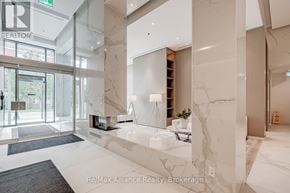 Burlington (Brant) condo for rent - A spacious lobby with marble floors and a glass wall.