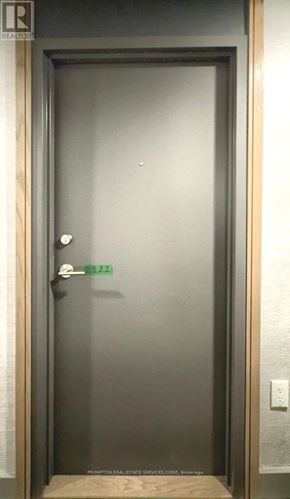 Toronto (Waterfront Communities) condo for rent - A door with a handle and a doorknob is open.