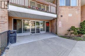 Toronto (Morningside) townhouse for rent - A building entrance with a no parking sign on the wall.
