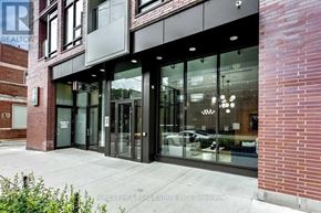 Toronto (South Riverdale) condo for rent - The front of a building with glass doors and windows.