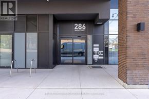 Toronto (East End-Danforth) condo for rent - The entrance to a building with a glass door and a sign that reads "286 Main Street.".