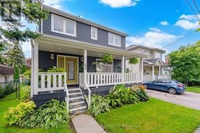 Toronto (O'connor-Parkview) apartment for rent - A two-story house with a front porch and a car parked in the driveway.